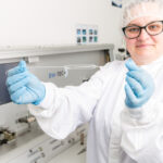 Photo of lab technician showing Balloon Catheter, Galway city Ireland Ridgeback Technologies industrial process photography
