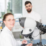 Photo of lab technician at microscope, Galway city Ireland Ridgeback Technologies industrial process photography