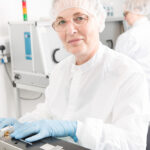 Photo of female lab technician at machine , Galway city Ireland Ridgeback Technologies industrial process photography